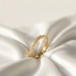 The Bezel Station Half-Eternity Ring