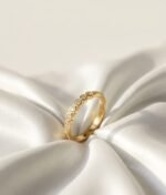 The Bezel Station Half-Eternity Ring